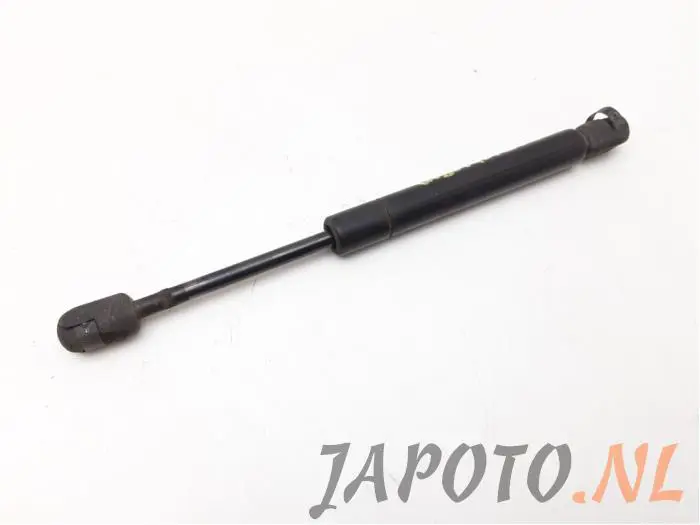 Rear gas strut, left Nissan Primera