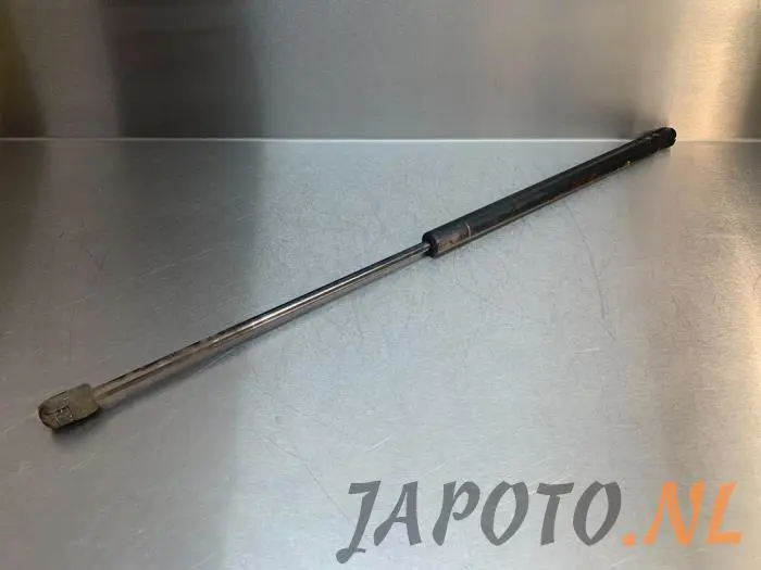 Rear gas strut, left Kia Carens