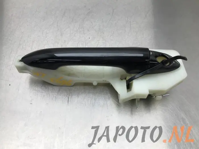 Door handle 4-door, front left Kia Carens