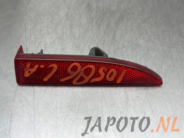 Rear bumper reflector, left Mitsubishi Colt