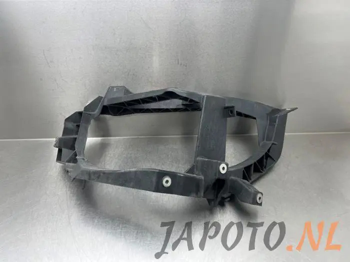 Headlight frame, left Mitsubishi Colt