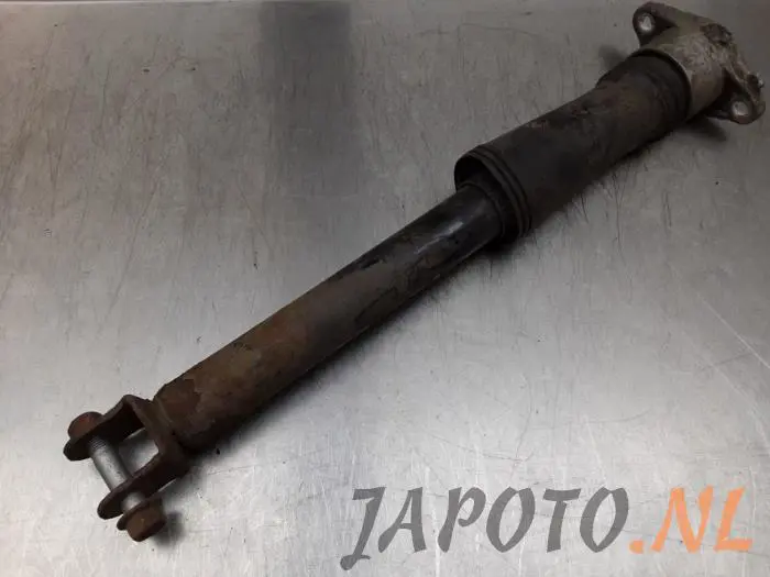 Rear shock absorber, left Kia Carens